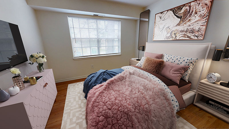 bedroom with pink accents at The Residences at Brookside